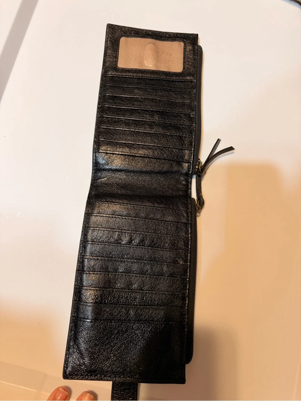 The Sak Black Leather Zip-Around Wallet with Gold Stud Trim